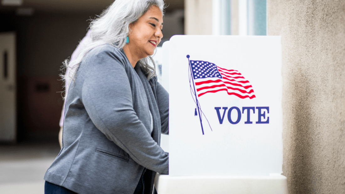 Woman at a voting booth