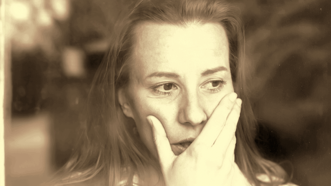 Woman looking out of window