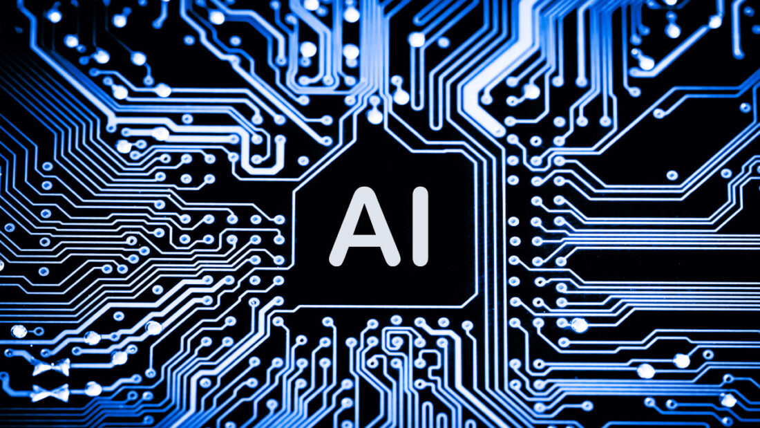 Close-up of a circuit board with glowing blue pathways. The central processing unit is labeled "AI" in bold white letters.